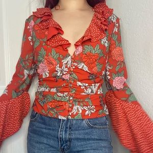 Red polka dot floral ruffle blouse